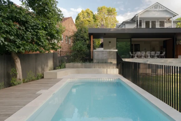 Tiled pool alongside timber deck with view back to extended home – Pymble custom build