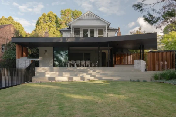 Open-plan living area connecting to backyard through floor-to-ceiling sliding glass doors – Pymble renovation